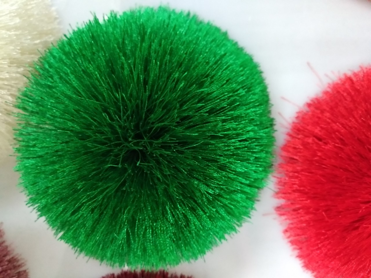 We supply cute hats, wool balls, polyester embroidered thread shoes, flower balls, tassels, decorative scarves and plush ball hangers