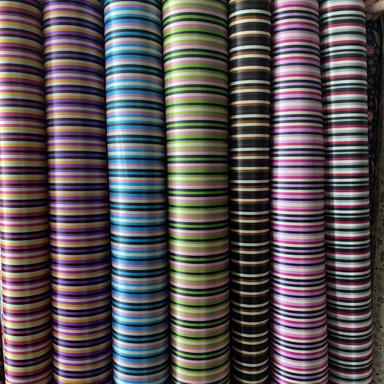Yiwu gran color tinte impresión poliéster impresión inferior espuma de PVC bolsa de maquillaje bolsa de equipaje tejido de cubierta de viento
