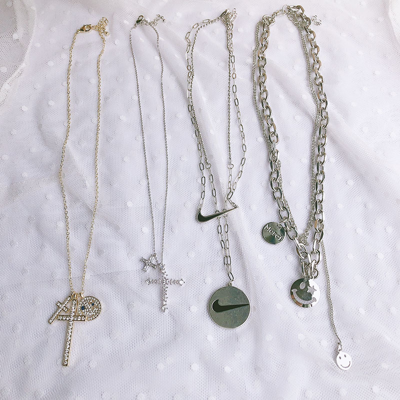 时尚酷女冷淡风INS欧美笑脸十字架钩子ins风潮人个性多层秋冬毛衣