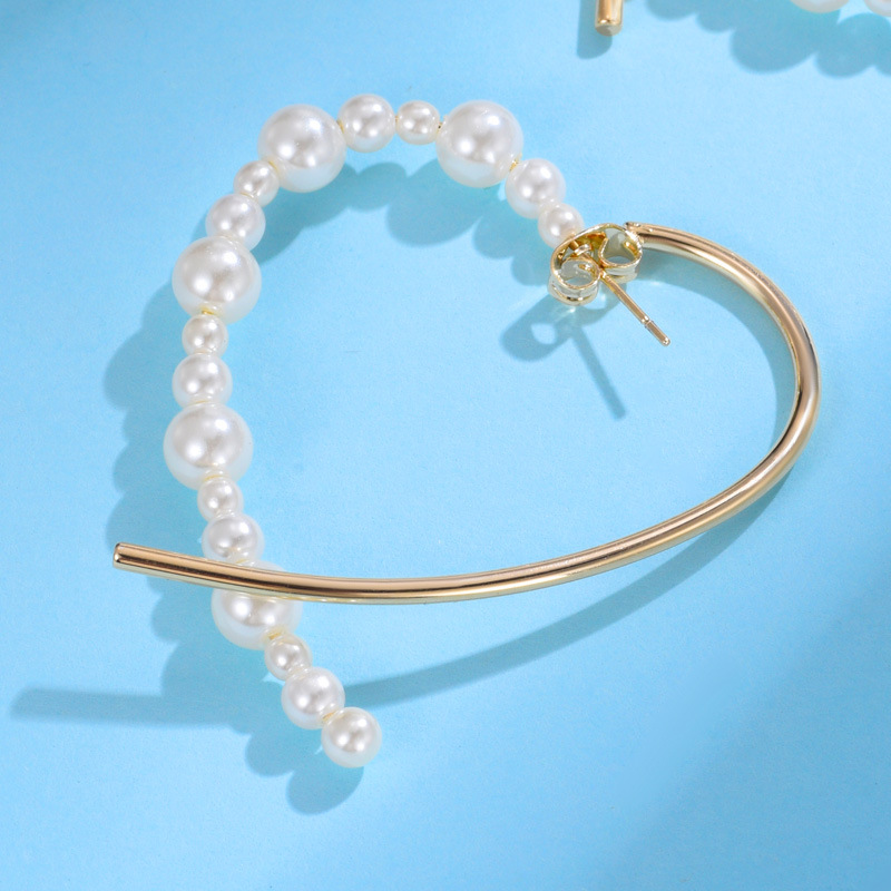 Heart-shaped simple earrings, Korean stud jewelry wholesale, Dongdaemun fashionable French high-end style pearl earrings