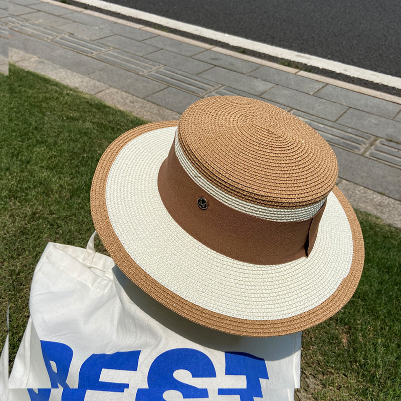 A popular flat-topped straw hat for women, a Korean-style trendy summer beach sun protection hat, a top hat, and an M-letter woven fisherman's hat undefined