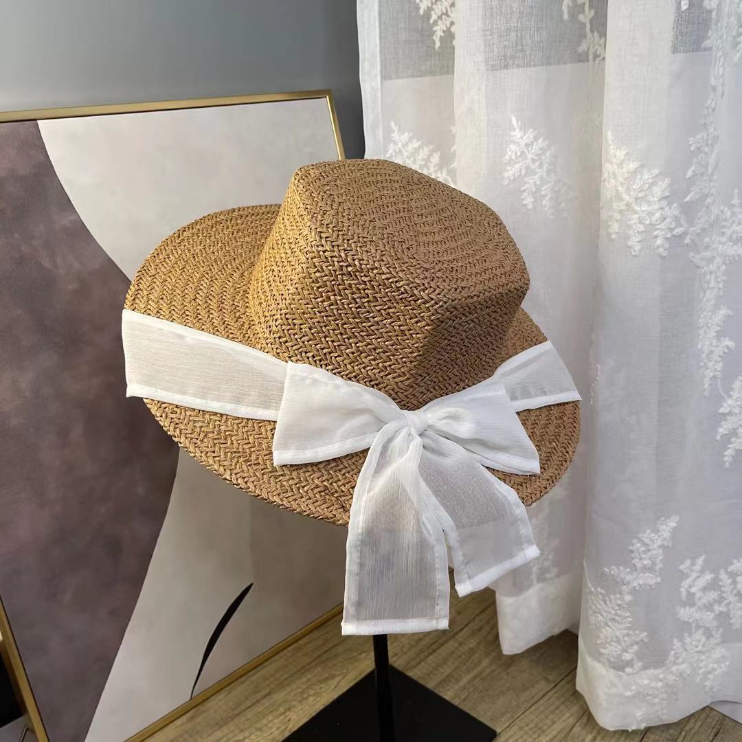 A female hat with a spring and summer ribbon, butterfly sash, hexagonal straw hat, Korean street style, anti-ultraviolet sun hat, and a wide-brimmed hat undefined