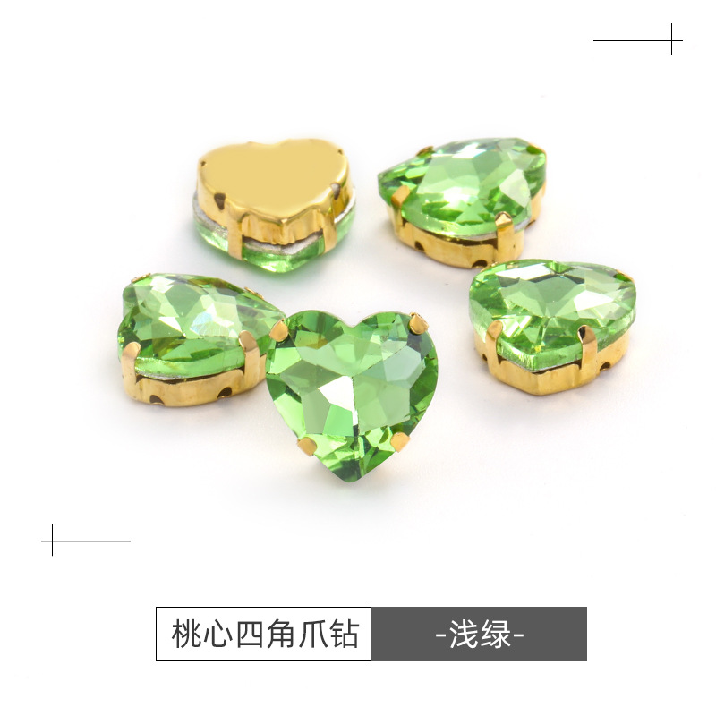 Factory wholesale of heart-shaped hand-sewn gold bottom claw diamonds, DIY wedding dress accessories, hand-sewn diamonds with holes, glass diamonds undefined
