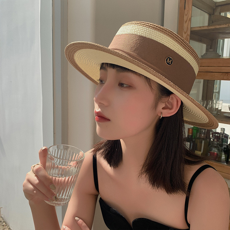 A popular flat-topped straw hat for women, a Korean-style trendy summer beach sun protection hat, a top hat, and an M-letter woven fisherman's hat details Picture