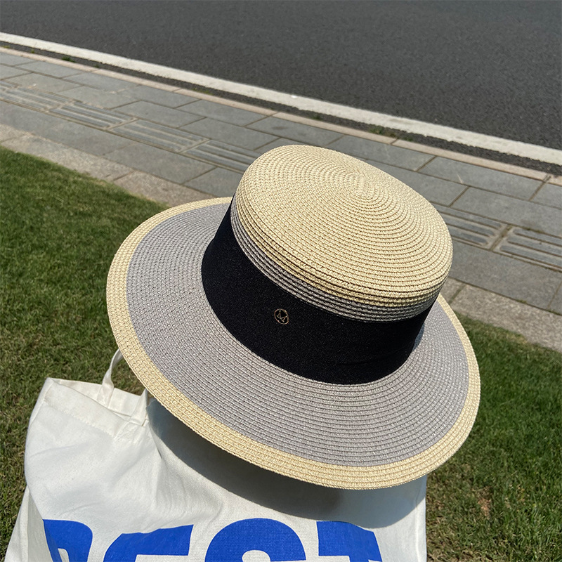 A popular flat-topped straw hat for women, a Korean-style trendy summer beach sun protection hat, a top hat, and an M-letter woven fisherman's hat undefined