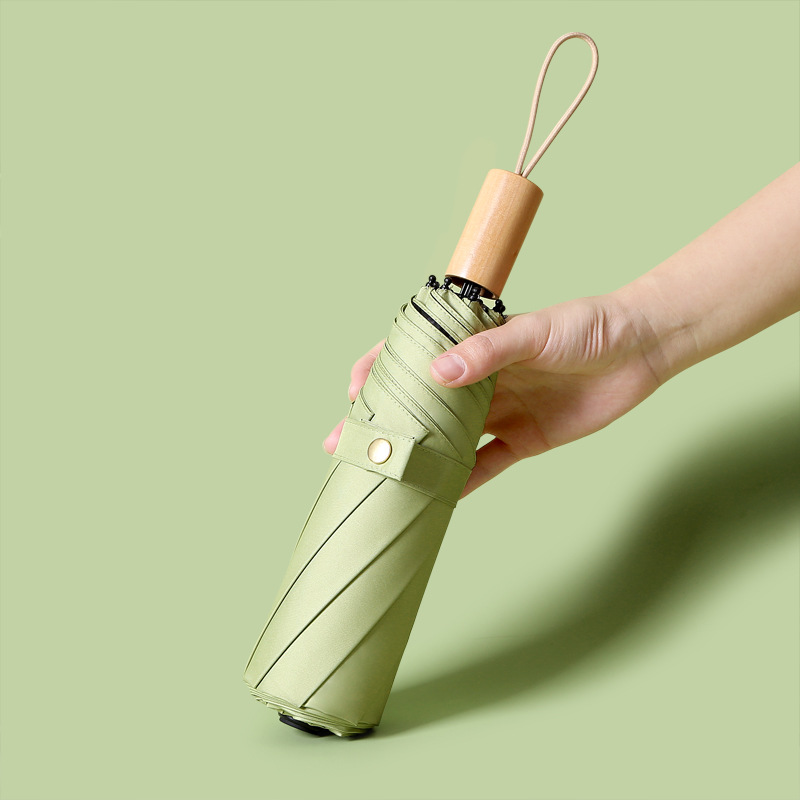 A fresh and artistic umbrella, a simple solid-color wooden handle umbrella, a folding umbrella, a creative gift umbrella for both weather and rain, custom-made details Picture
