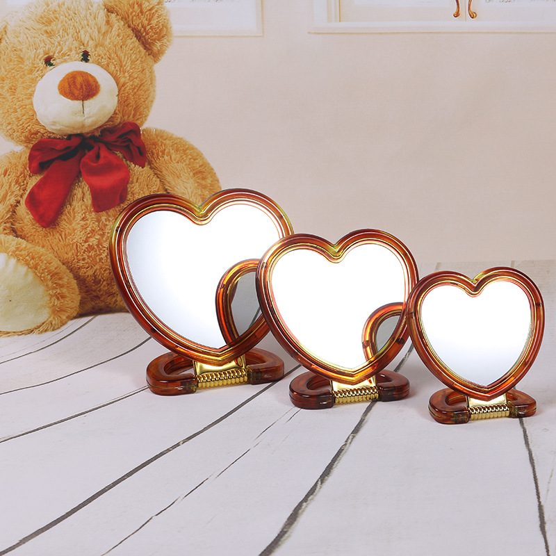 Supply Creative Heart-Shaped Two-Color Double-Sided Mirror Hanging Table Coffee Plastic Vanity Mirror Makeup Mirror Wholesale Makeup Mirror Makeup Mirror Application Scenario