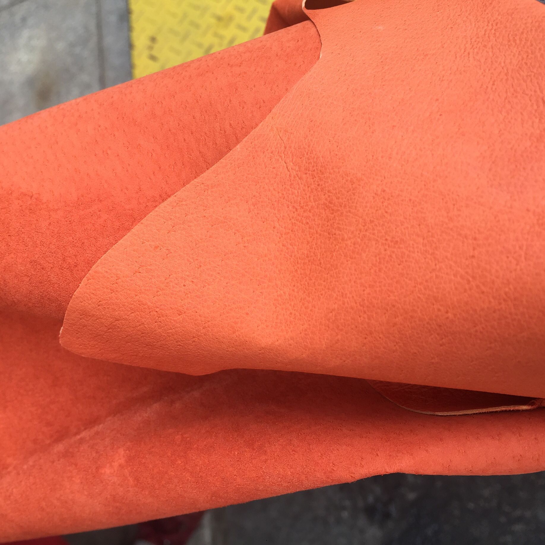 Ha Niu genuine leather top layer pigskin, second layer pigskin in orange color, available in stock