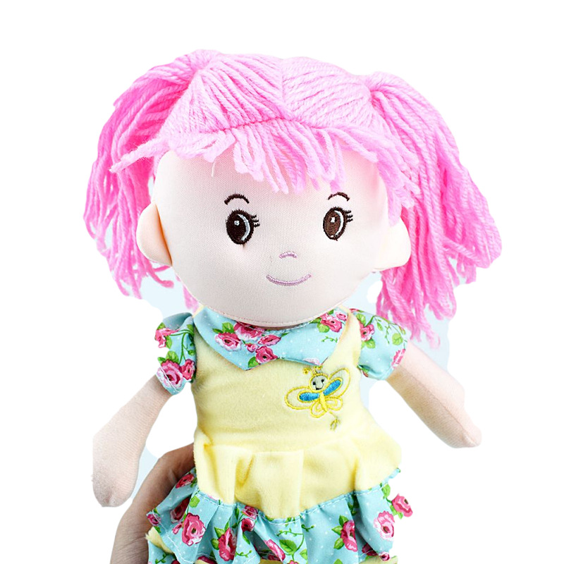 A cute girl in a double-layered floral dress in blue, pink and purple, with a doll as a toy gift, is crossing the border Specification image