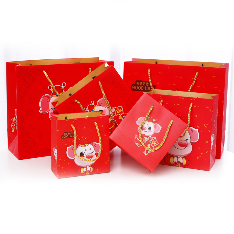 Factory direct sales of cute cartoon Year of the Pig hand-held packaging bags, gift bags, paper bags, return gift bags, customized