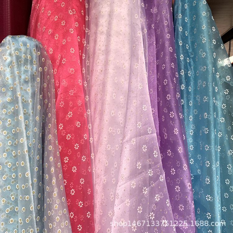 涤纶印花面料婚纱礼服连衣裙童装玩具头网纱饰发饰云彩纱布料产品图