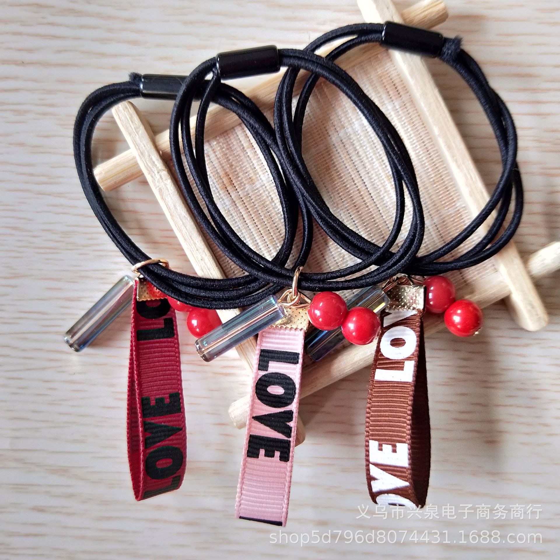 Short ribbon hair ties, letter ribbons, red pearl hair ties, fashionable and popular rubber bands, wholesale of small general merchandise at one Yuan store