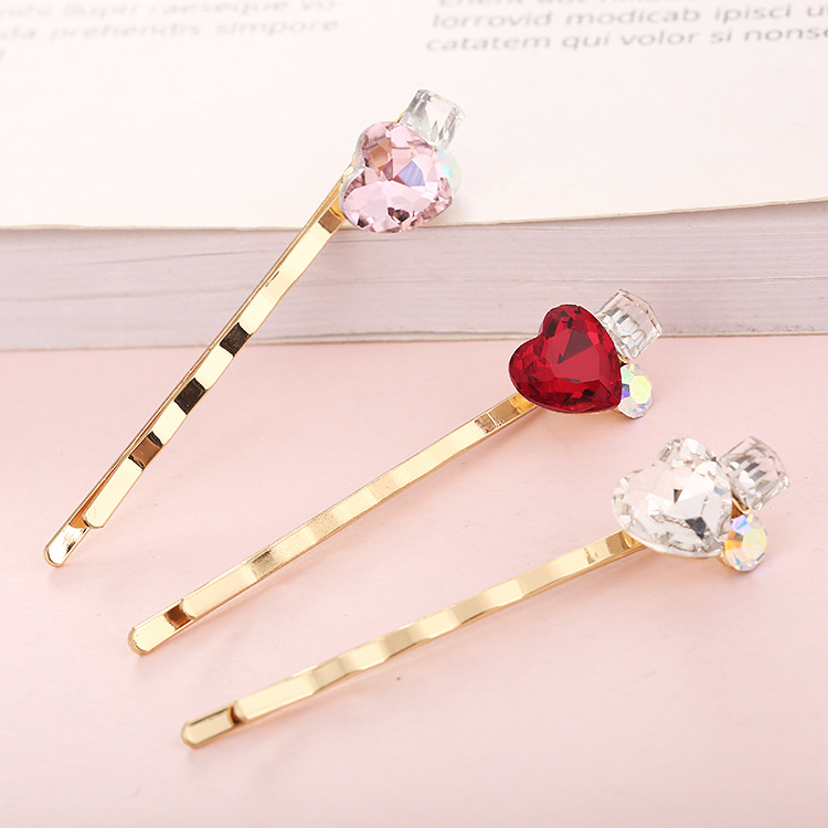 Wholesale of Korean-style crystal hair clips, hair accessories, one-piece clips, gold-plated colored heart-shaped patches, heart-shaped edge clips, and bangs clips