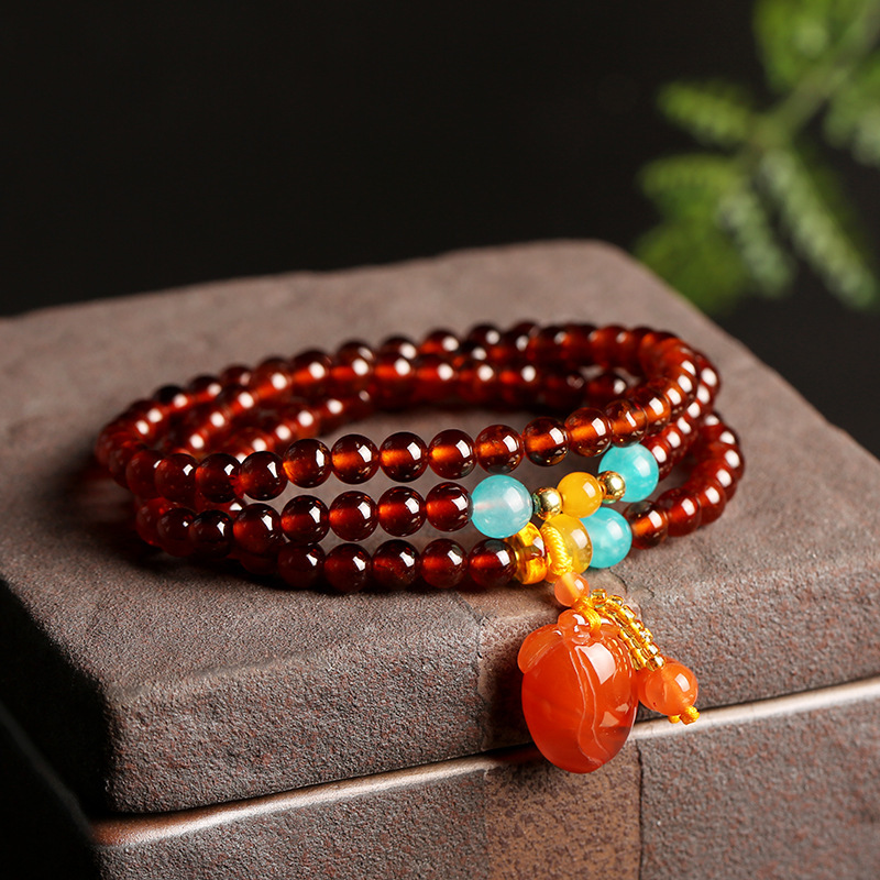 Natural orange-red garnet bracelet with three loops of 5.5mm round beads, paired with a DIY beeswax south red bracelet details Picture