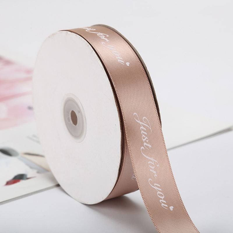 The manufacturer supplies 2.5cm solid-color printed flower packaging English ribbon bow binding straps and 45-meter packaging straps Application Scenario