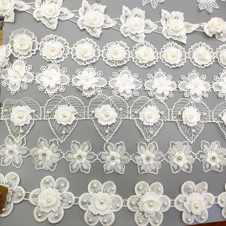 厂家直销蕾丝花边涤纶牛奶丝花边水溶手工钉珍珠条码服装辅料绣花