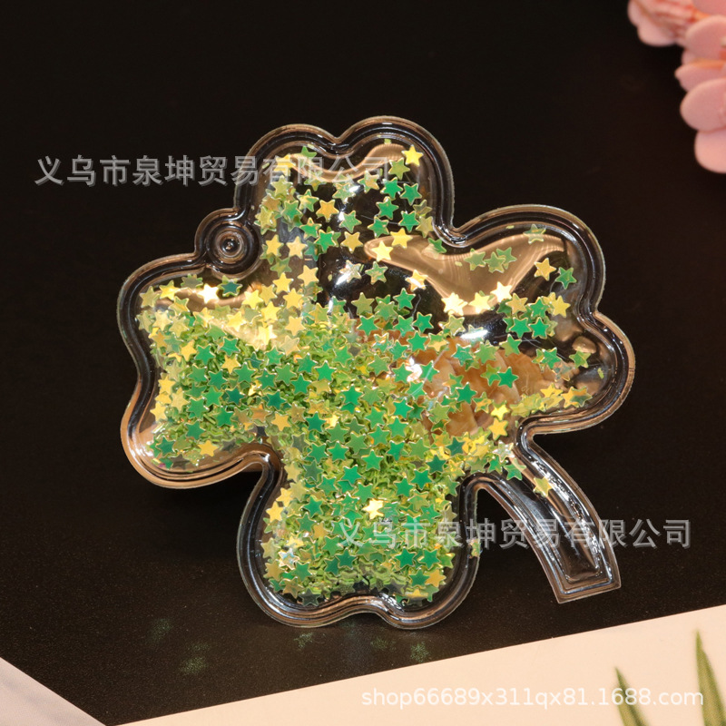 Factory PVC cartoon transparent flowing sand golden four-leaf clover key buckle hair band mobile phone case children's DIY accessory Item Picture