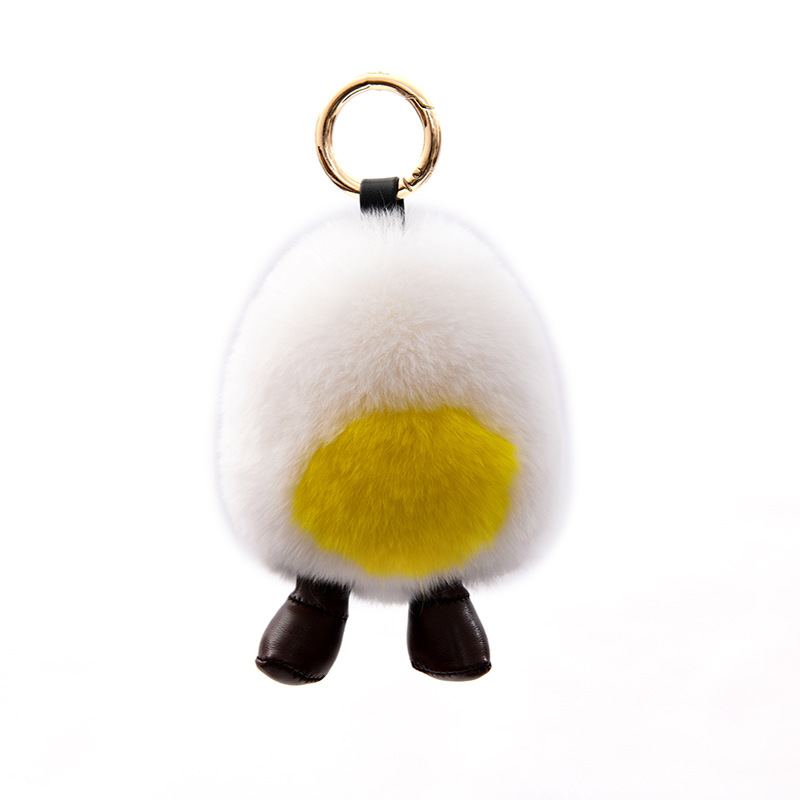 包包挂件毛球白底实物图