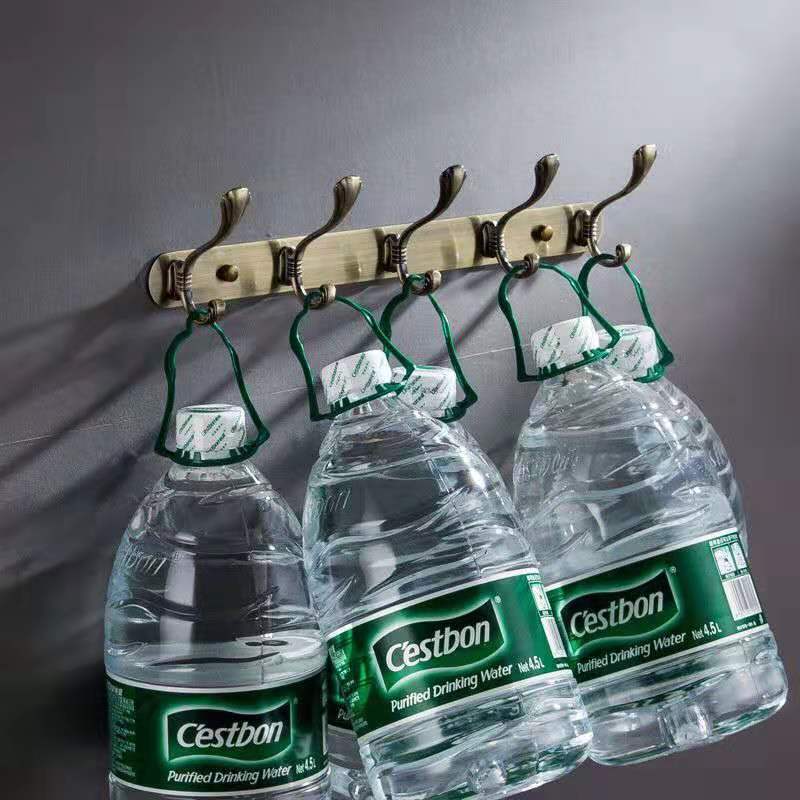 A row of European-style stainless steel hooks. Metal hooks on the wall behind the entrance of the fitting room door in hotels and guesthouses do not require drilling details Picture