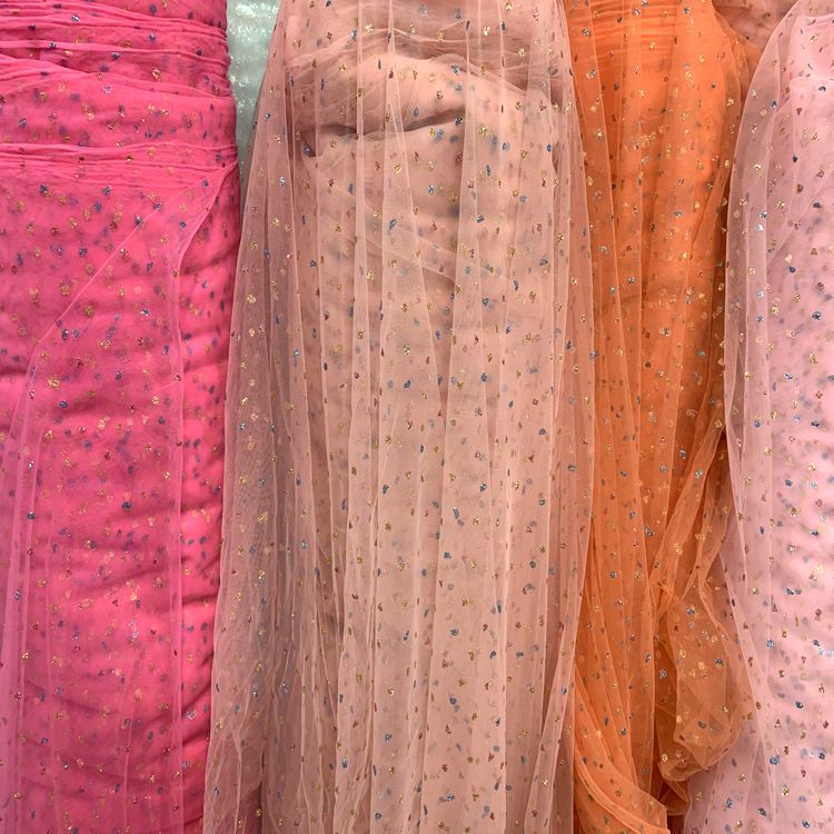 Wholesale of knitted mesh fabric for clothing, toys, puffy skirts, headwear, hair accessories, butterfly knot mesh fabric, and three-color mesh gauze Application Scenario