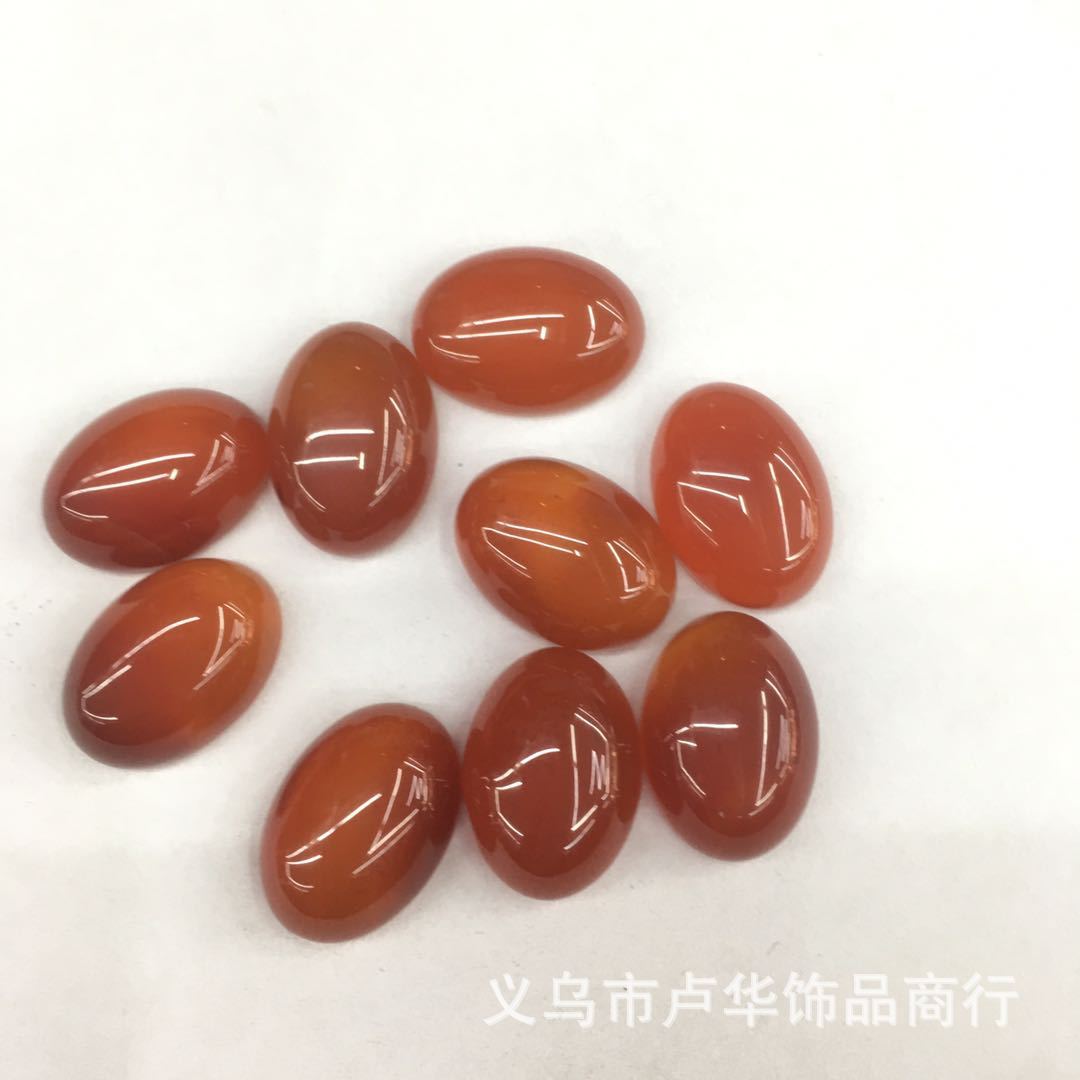 The manufacturer is selling wholesale of fashionable egg-shaped light red agate bare stone semi-precious stone ring face jewelry accessories and handicrafts from Europe and America