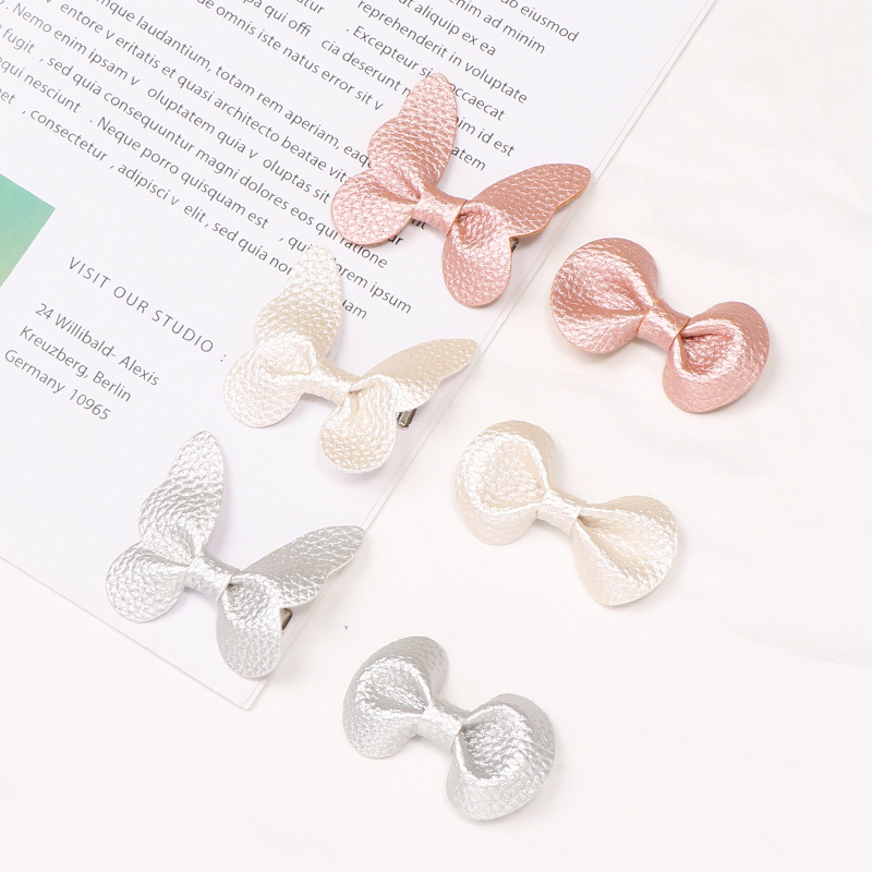 Ins Lychee Butterfly Hairpin 91208 Cross-Border Creative New Children's Hair Accessories Solid Color Round Ear Bangs Clip Application Scenario
