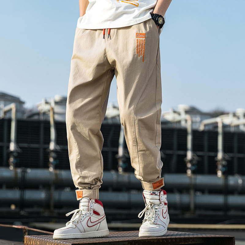One-piece consignment of 2021 Spring and Autumn new men's black casual pants, men's personalized printed and trendy workwear pants for teenagers