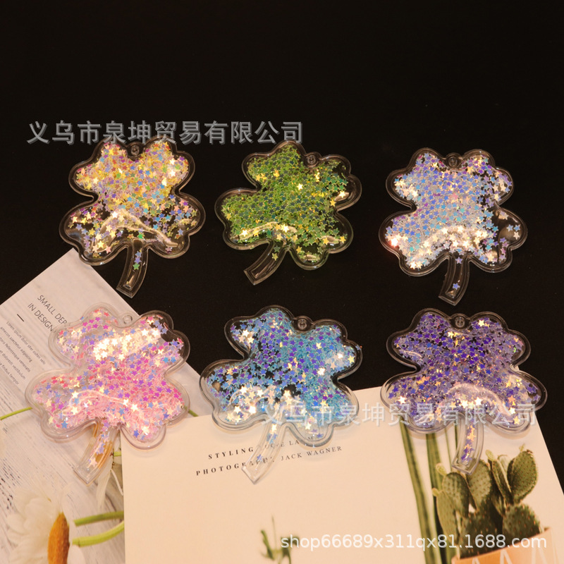 Factory PVC cartoon transparent flowing sand golden four-leaf clover key buckle hair band mobile phone case children's DIY accessory