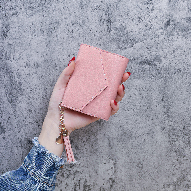 Venta directa de fábrica nuevo estilo mujer billetera mujer borla colgante litchi patrón clip de dinero tarjeta bolsa cero billetera en stock al por mayor Application Scenario