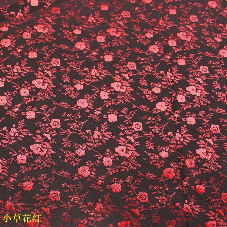 国潮黑底小红花提花布料布匹黑色人丝小草花鞋材服装面料提花布面料