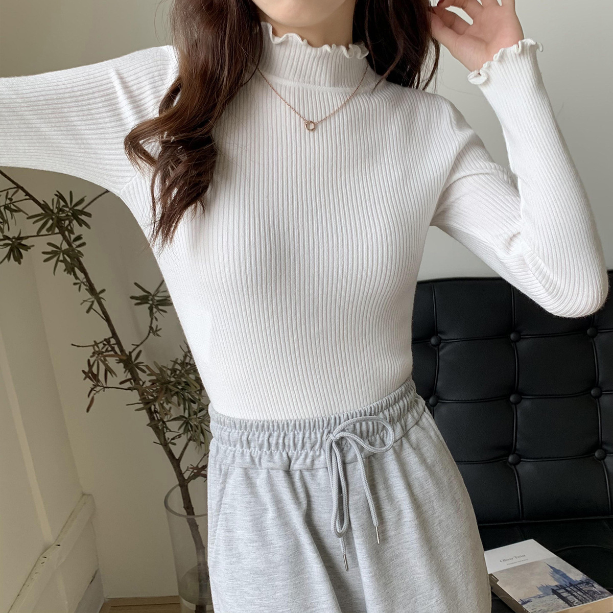 A new women's semi-high-neck long-sleeved knitted sweater with black ear trim for the 2022 autumn and winter season, which can be worn as an inner layer