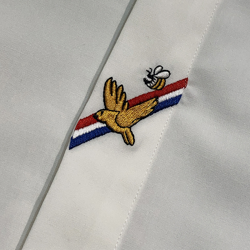 This is a new men's trendy brand from European Spring and Autumn. It features a slim and stylish bird-embroidered shirt and a high-end simple woven strap with a slight elasticity Specification image