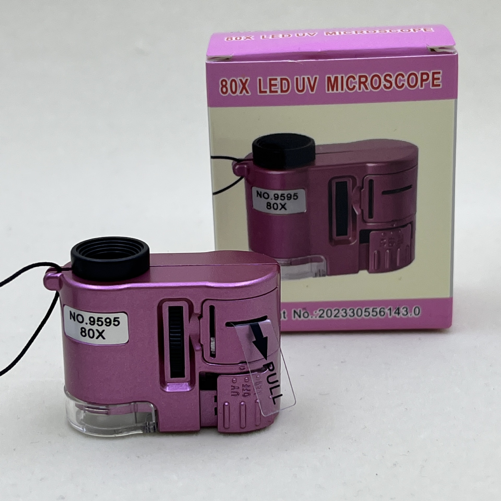 新款80倍光学 显微镜玉石字画鉴定便携迷你型带LED紫光灯显微镜