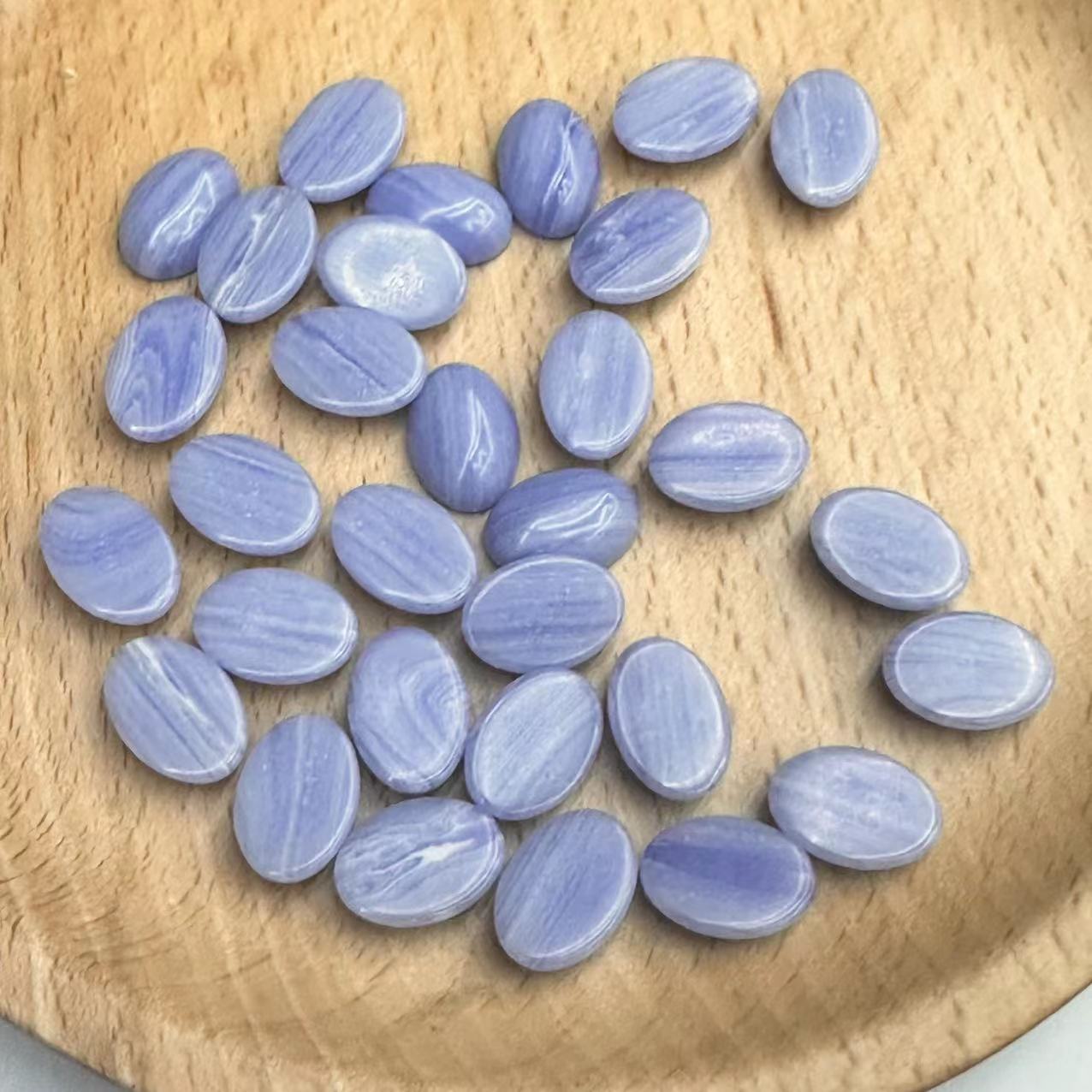 The manufacturer is selling a new type of synthetic purple agate Songdan shaped ring face, European and American fashionable crystal bare stone accessories wholesale loose beads