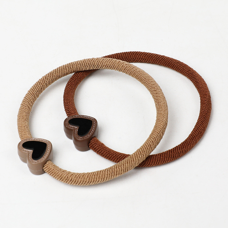 A new, stylish and simple hair band in milk coffee color, a heart-shaped Korean hair accessory that won't damage hair, a hair tie, a ponytail, and a leather band for women Specification image