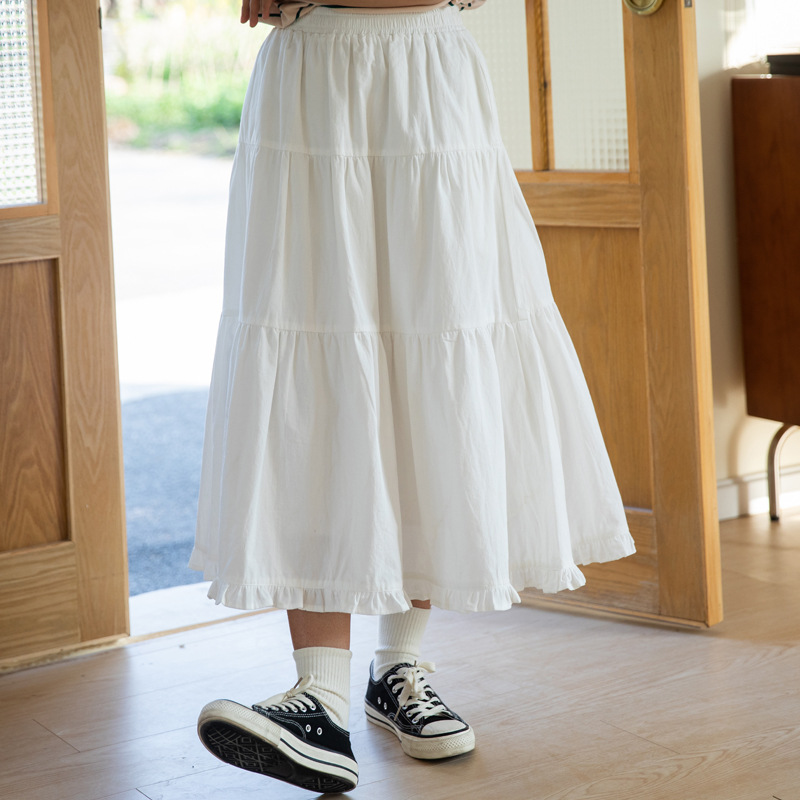 This is A new high-waisted mid-length skirt for women in summer, featuring a fresh and elegant Japanese style with a white A-line design Application Scenario