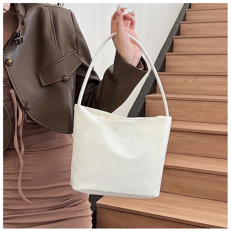 This is a rare and high-end mucu and ebony fashion embroidered nylon versatile underarm single-shoulder handbag for women Specification image