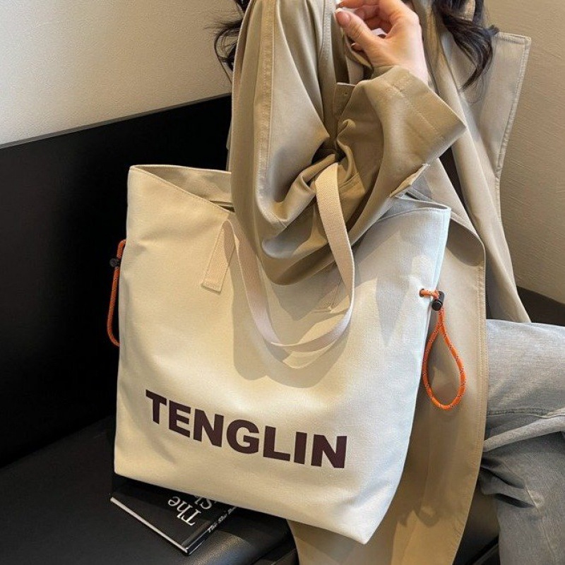 简约字母尼龙布包包女2024夏季新款学生上课单肩托特包大容量通勤