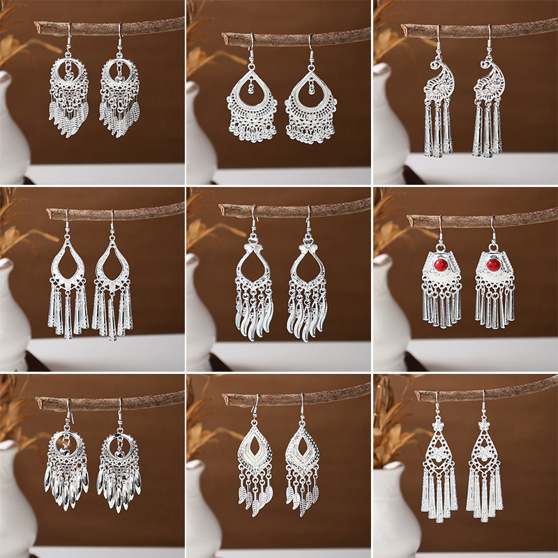 Accesorios de ropa hmong plumas largas borlas imitación miao plata pendientes viento minoritario clásico varios tipos de pendientes auriculares Specification image