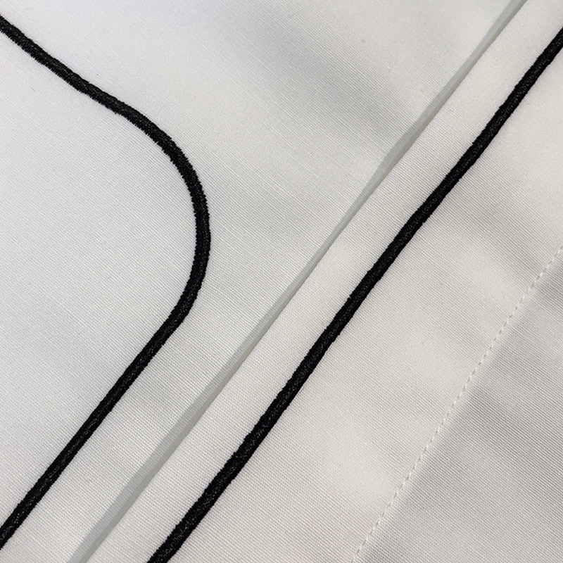 A new European-style simple and elegant solid-color shirt for men's spring and summer, featuring geometric pattern embroidery and a fitted business long-sleeved shirt Application Scenario
