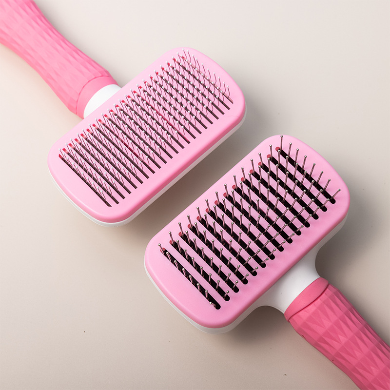 A rubber-handled pet comb with fine and coarse needles, automatic dog hair removal, cross-border pet product massage comb details Picture