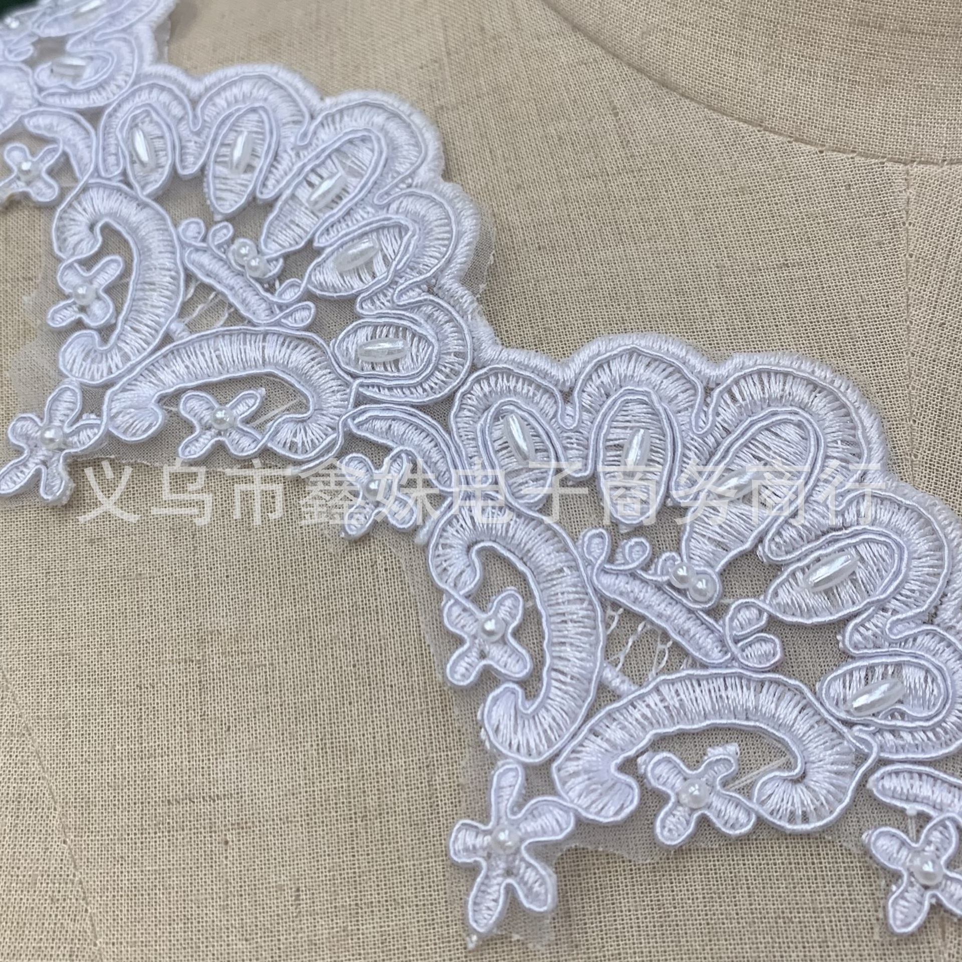 Light luxury and fashionable cheekbone pearl embroidered lace clothing with bow pendant beaded flower edge decoration and lace trim details Picture