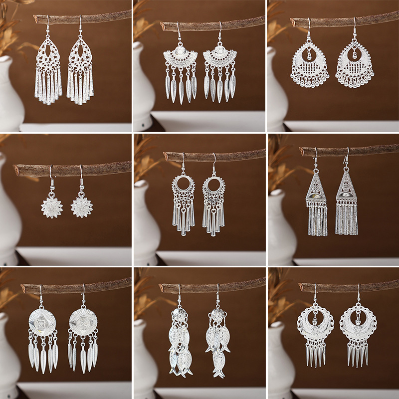 Accesorios de ropa hmong plumas largas borlas imitación miao plata pendientes viento minoritario clásico varios tipos de pendientes auriculares details Picture