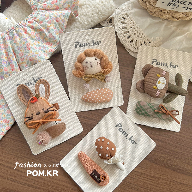 2025 New cartoon and cute fabric cotton stuffing children's rabbit embroidered pom-ball hair clip, cute girls' fringe seaside clip Specification image