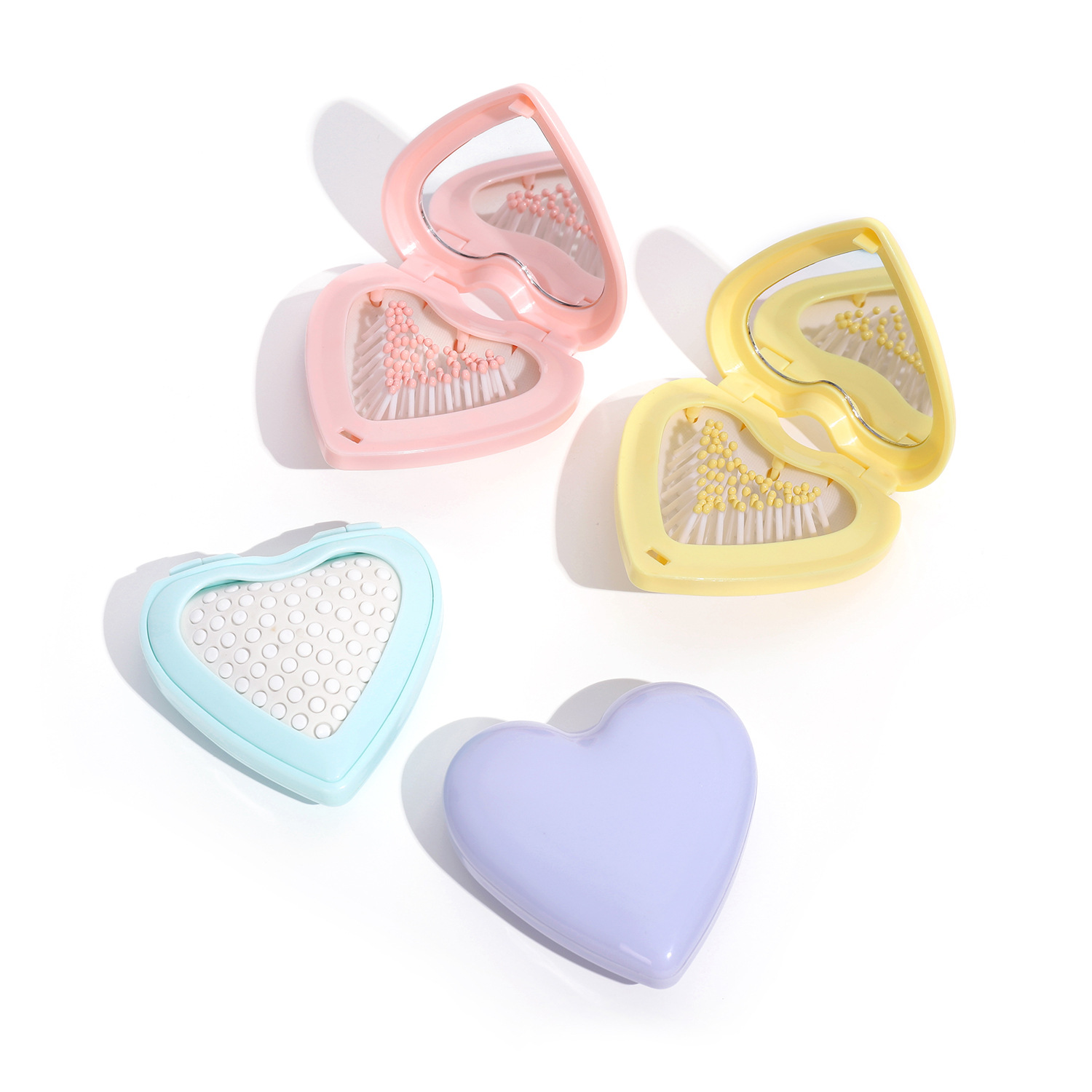 Huiyun's new heart-shaped folding portable mirror comb for massaging the scalp is a cute gift comb for young girls and students