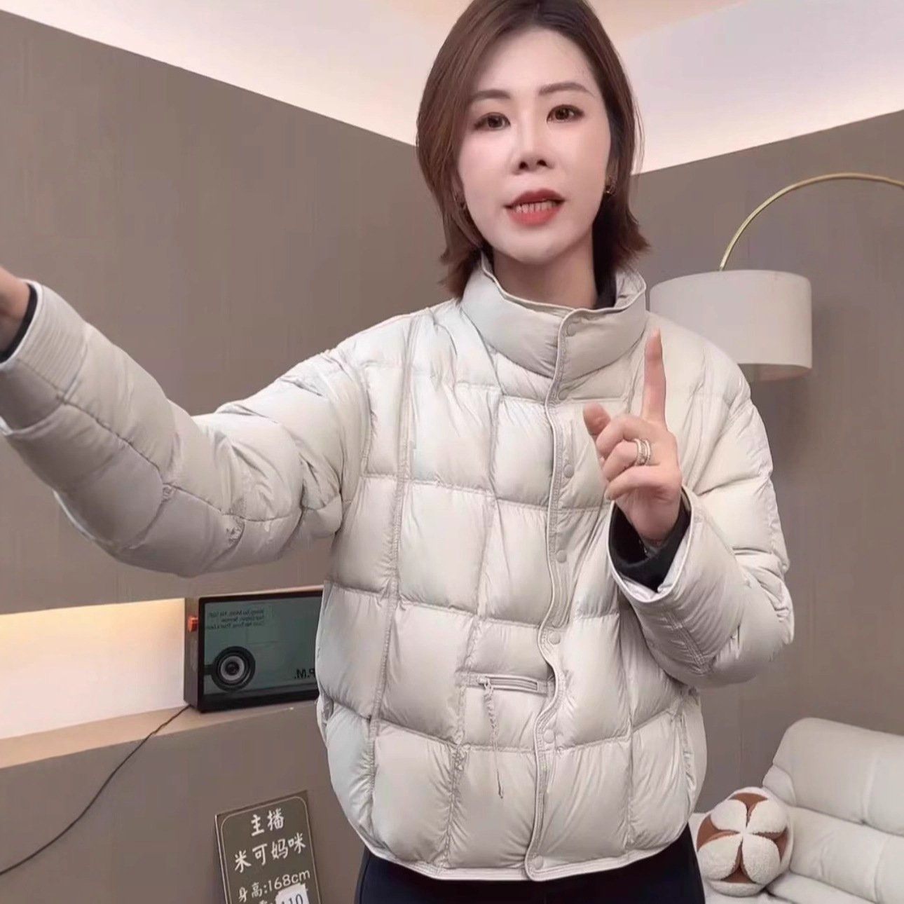The new winter down jacket for women in 2025 features a short stand-up collar, thickened and warm white duck down bread coat in a simple style details Picture