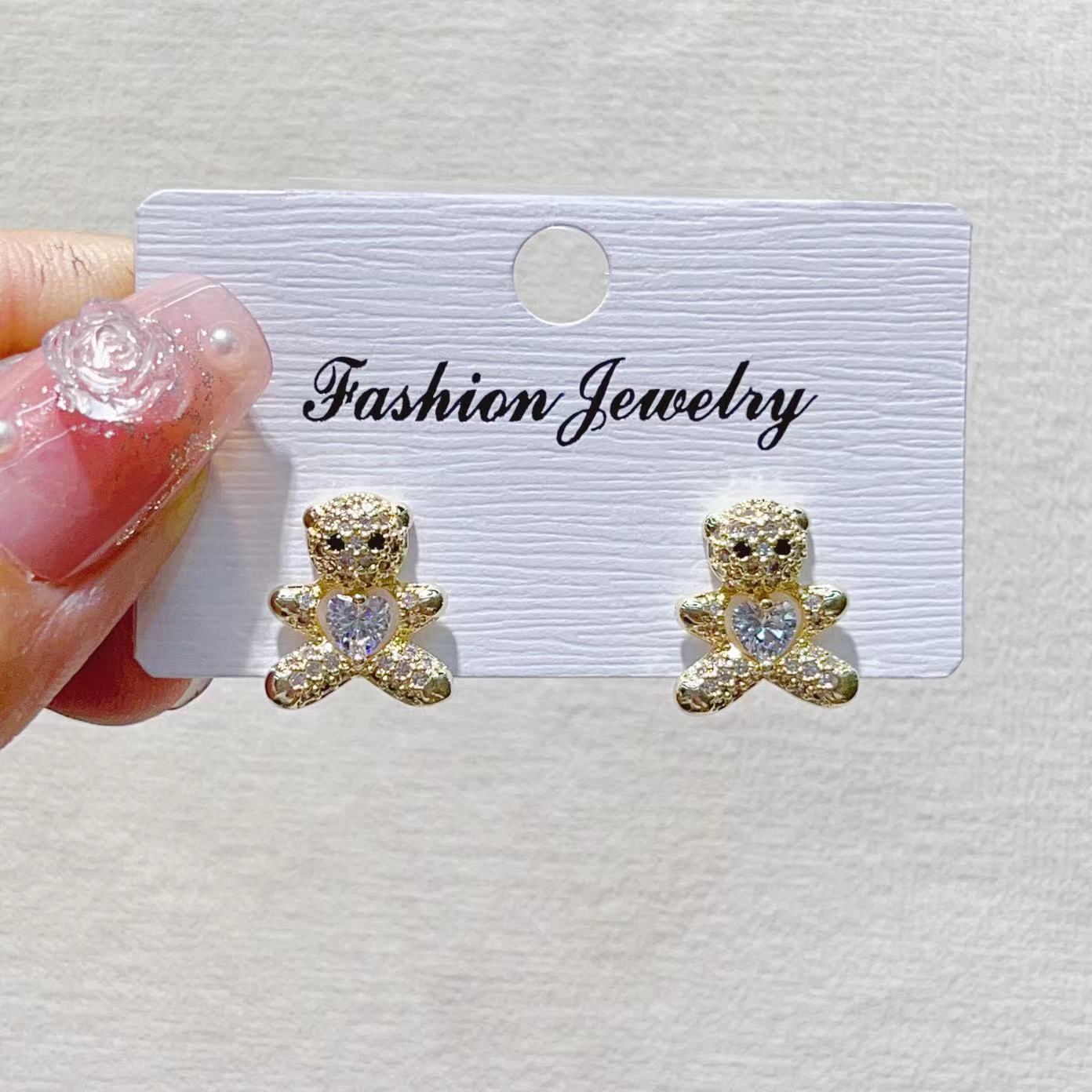 The trendy, light luxury, fresh smiley face, leaf, copper plated with real gold and slightly inlaid zircon, light luxury, niche design of INS ear studs Specification image