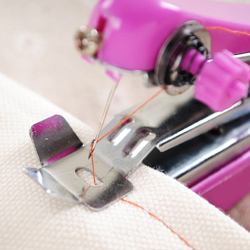 Portable mini sewing machine, a simple hand-held sewing tool for embroidery and tailoring details Picture