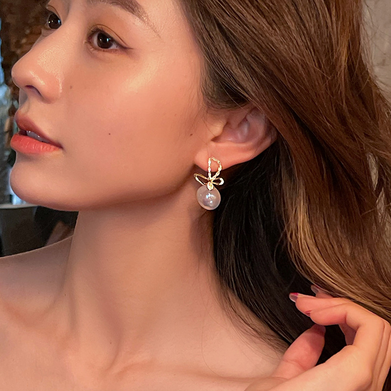 S925 Silver Needle Light Luxury Fringe Earrings Temperament Bow New Slimming Pearl Studs Earrings Wholesale details Picture