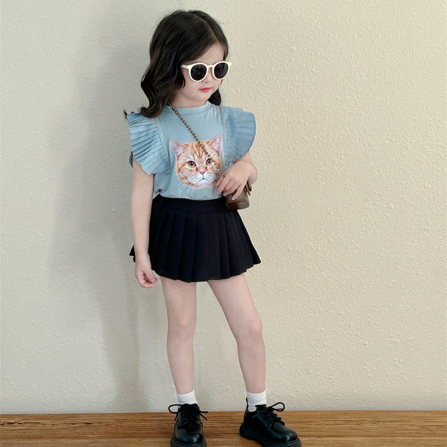 This is a new summer children's clothing style for 2024, featuring a cute and stylish bellows-pleated short-sleeved T-shirt for girls Specification image